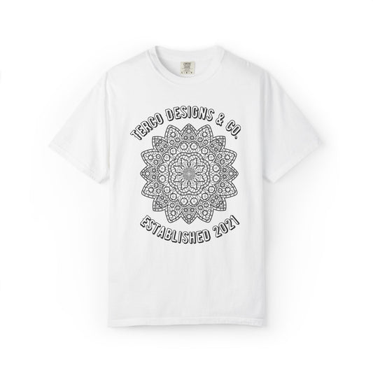 White t-shirt with black mandala design and text on a white background